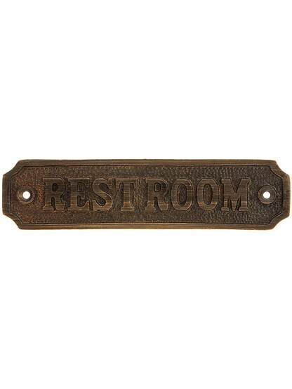 Cast Brass Restroom Sign in Antique Brass.
